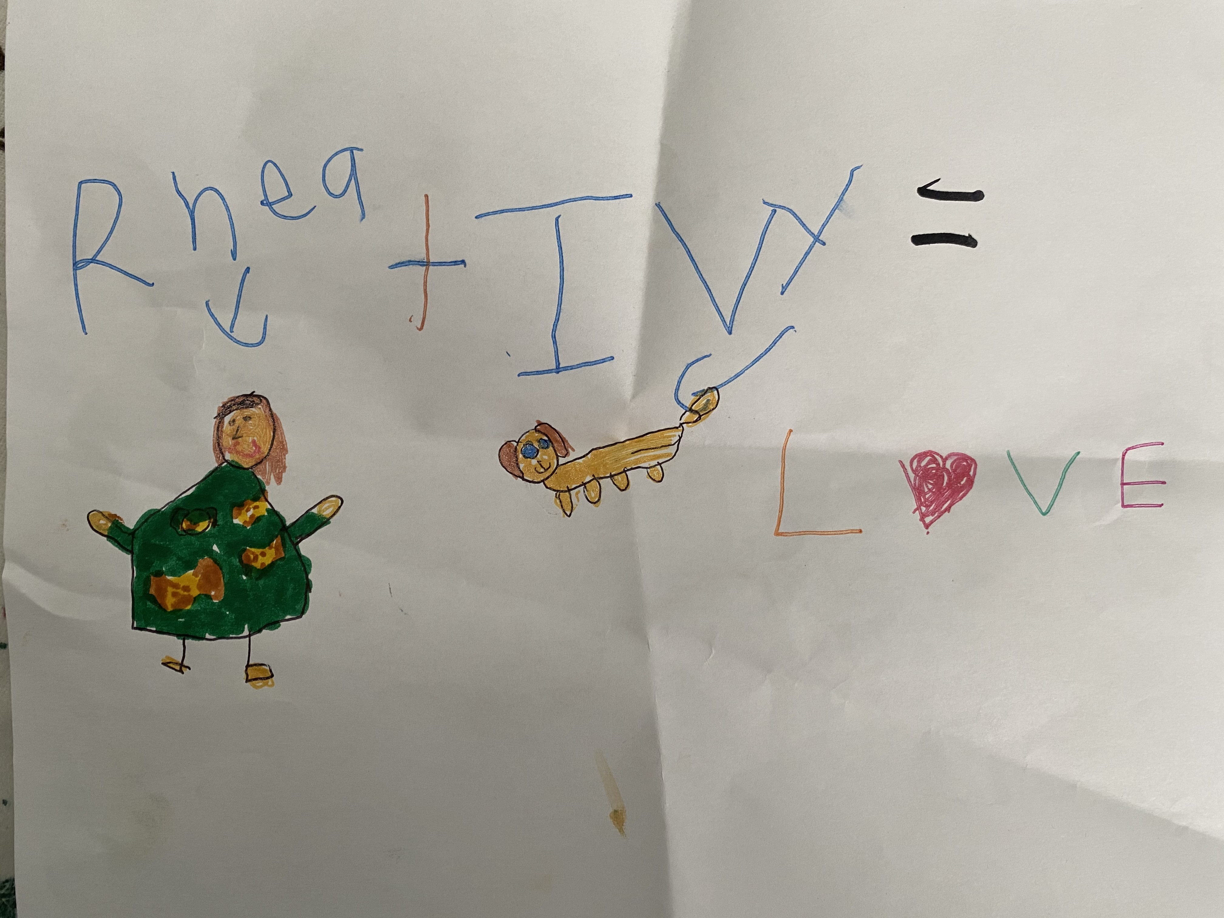 A drawing that Rhea did of herself and Ivy with the words “Rhea + Ivy = Love”.
