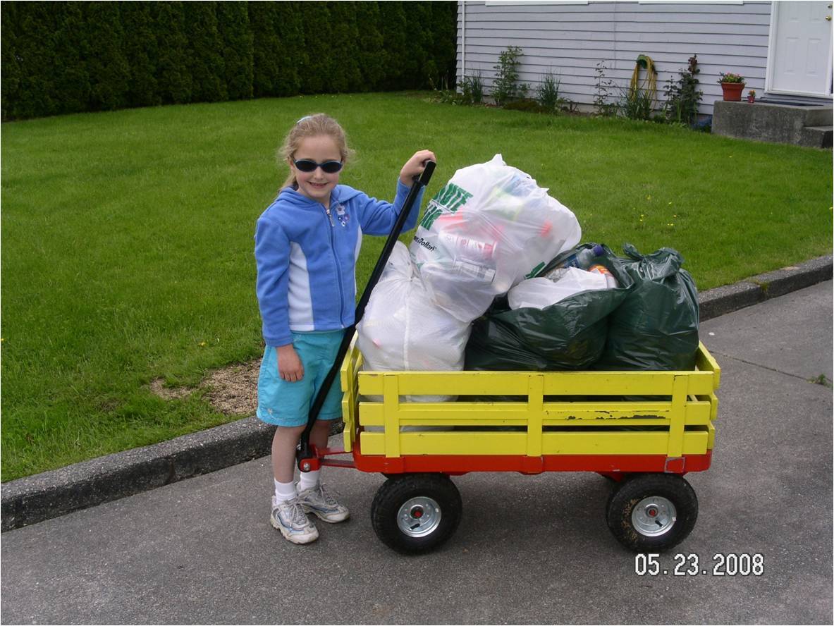 It's 2008 and Veronika is a small child towing around a wagon filled with bags of recyclable bottles. 