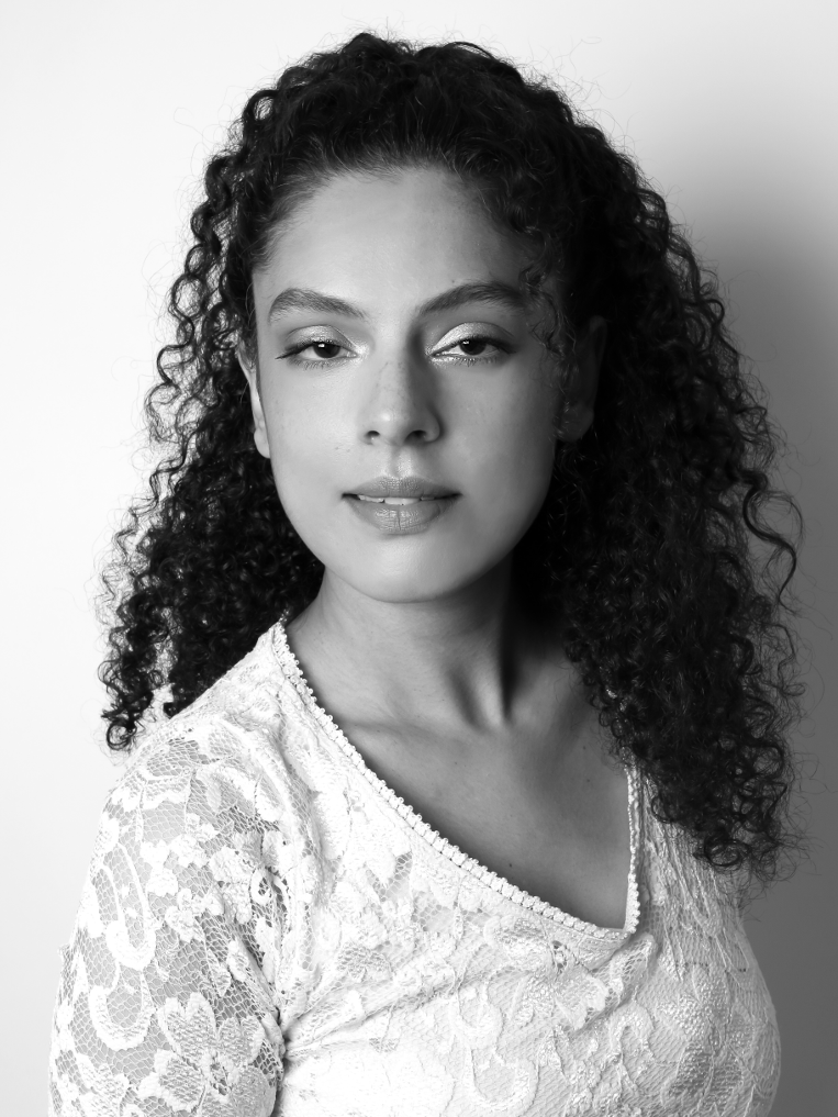 A black & white professional headshot of Vinita Puri