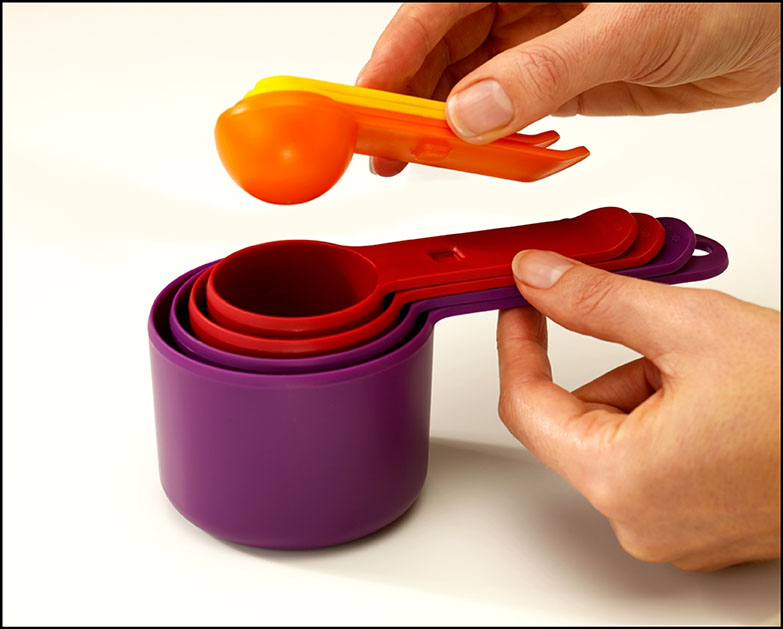 Brightly coloured nested measuring cups 