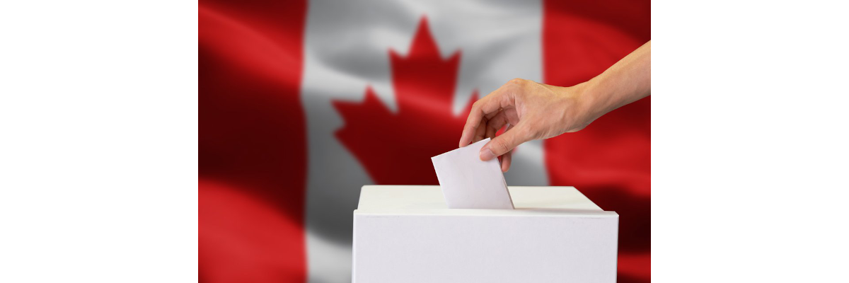 A hand dropping a ballot into a box; the Canadian flag in the background.