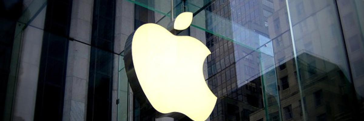 Exterior view of an Apple Store. Apple logo on a glass window. 