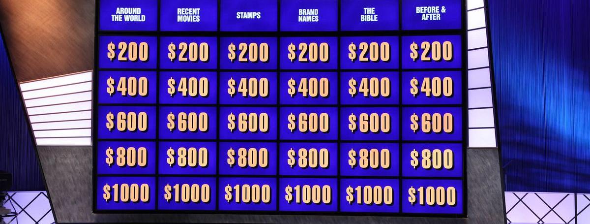 The jeopardy question board with categories and multiple dollar amounts displayed.