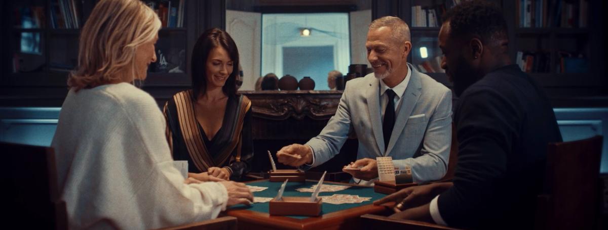 two men and two women playing bridge
