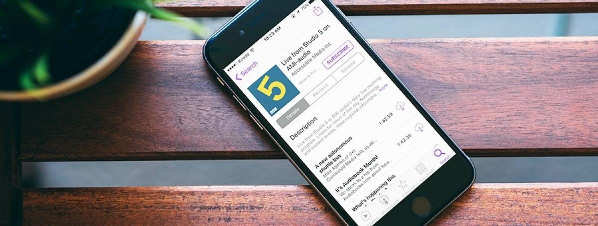A smartphone screen displays the AMI podcast app.