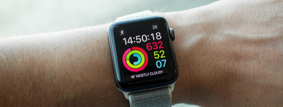 An extended arm wears an Apple Watch.