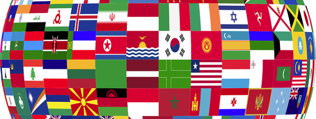An illustration of a circle. Inside the circle are all the flags from countries around the world.