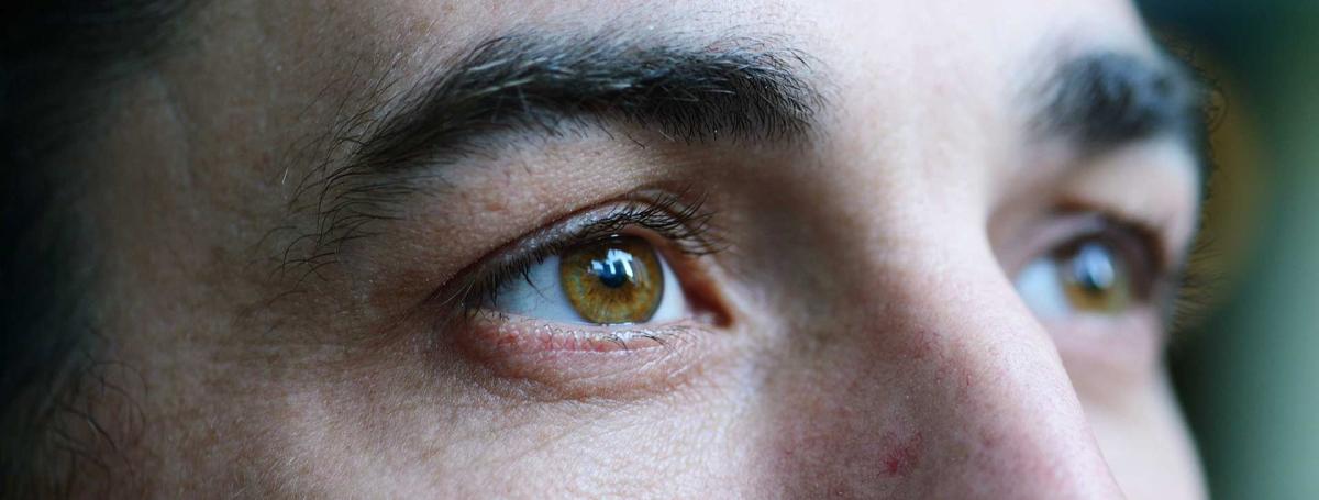 A close-up of a man's face with a focus on the eyes.