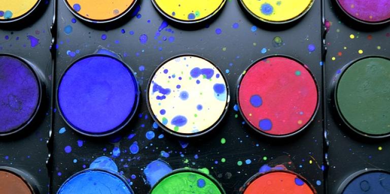 A painters pallet with 15 different colours.