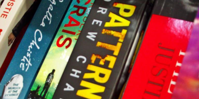 Close-up of books stacked together