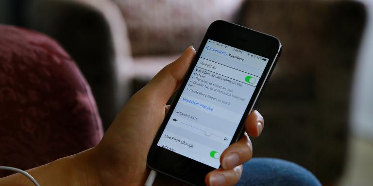 An iPhone screen displays the Accessibility menu.