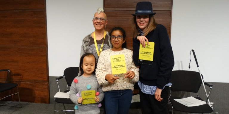 Winners from the 2019 Braille Creative Writing Contest Kelsey, Zara and Zachary pose for a photo with Karen Brophey. They are holding their awards