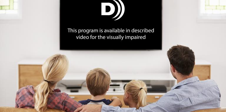 A photo of a family sitting on a couch watching a television screen that reads "This program is avaialble in described video for the visually impaired."