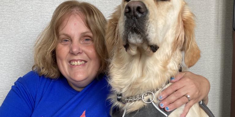 Chris Trudell-Conklin and her guide dog, Cody, a 3-year-old golden retriever