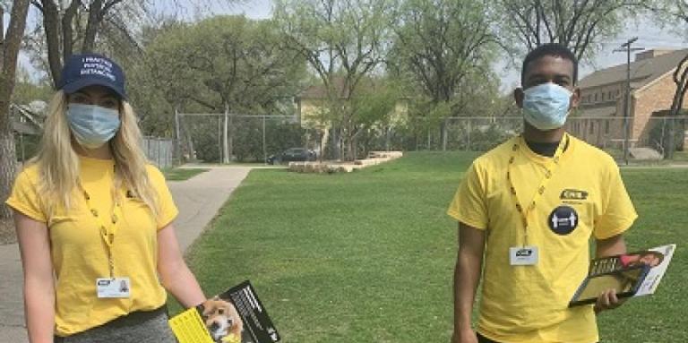 Two friendly CNIB canvassers smiling behind masks.