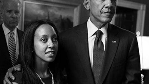 Haben Girma stands with Barrack Obama, while Joe Biden Stands in the background